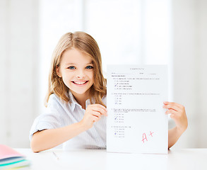 Image showing girl with test and A grade at school