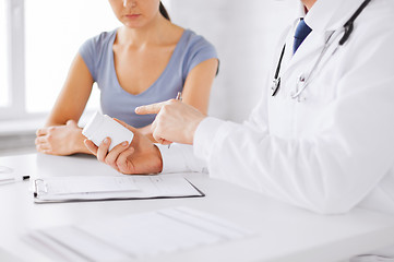 Image showing patient and doctor prescribing medication