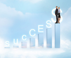 Image showing businessman and businesswoman on the top of chart