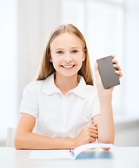 Image showing girl with smartphone at school