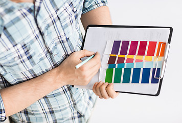 Image showing man with color samples for selection