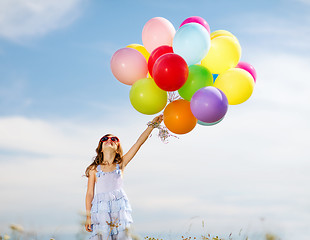 Image showing happy girl with colorful balloons