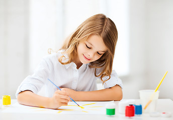 Image showing little girl painting at school