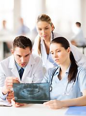 Image showing group of doctors looking at x-ray