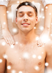 Image showing man in spa salon getting massage