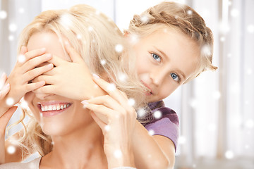 Image showing mother and daughter making a joke