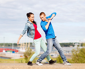 Image showing couple of teenagers dancing outside