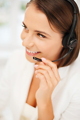 Image showing female helpline operator with headphones