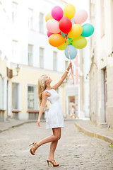 Image showing woman with colorful balloons