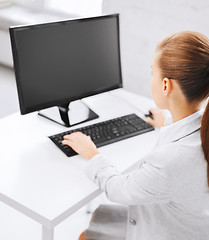 Image showing businesswoman with computer in office