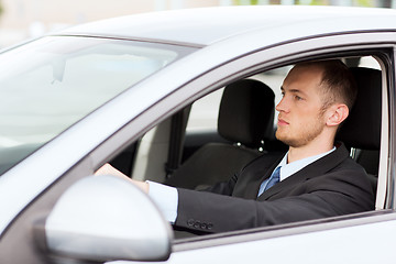 Image showing businessman driving a car