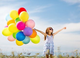 Image showing happy girl with colorful balloons