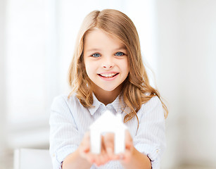 Image showing girl holding white paper house