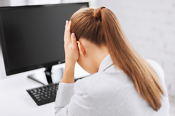 Image showing stressed woman with computer