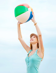 Image showing girl playing ball on the beach