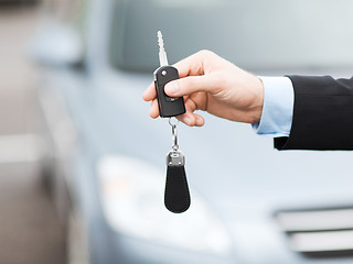 Image showing man with car key outside