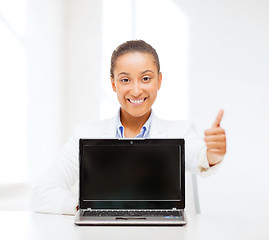 Image showing smiling woman with laptop computer