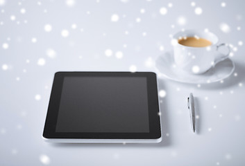 Image showing tablet pc with cup of coffee