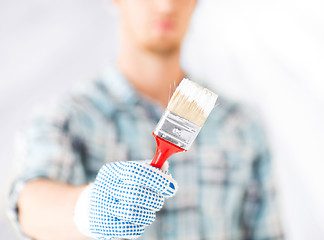 Image showing man hand with paintbrush