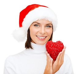 Image showing smiling woman in santa helper hat with red heart