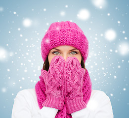 Image showing surprised woman in hat, muffler and mittens