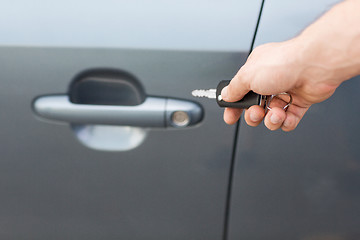 Image showing man with car key outside