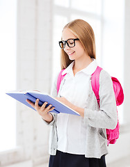 Image showing girl reading book at school