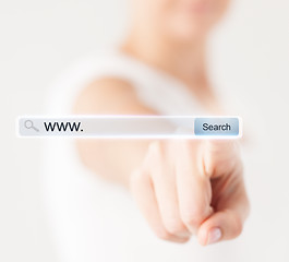 Image showing female hand pressing Search button