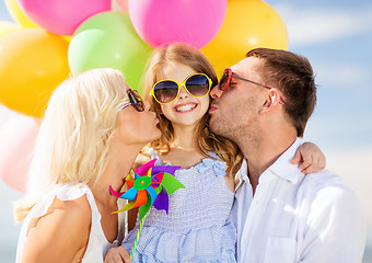 Image showing family with colorful balloons