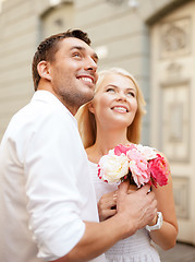 Image showing couple with flowers in the city