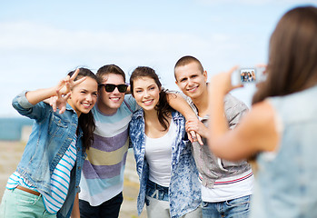 Image showing teenagers taking photo outside