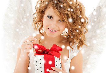 Image showing happy teenage angel girl with christmas gift