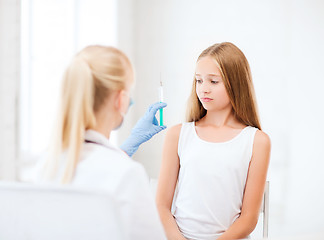 Image showing doctor doing vaccine to child in hospital