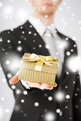 Image showing man giving gift box