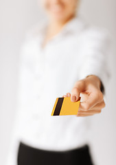 Image showing woman showing gold credit card