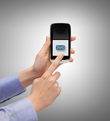 Image showing man with smartphone and message icon