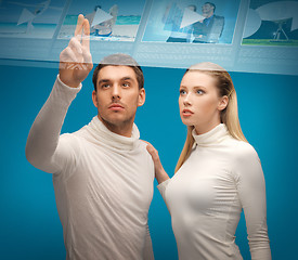 Image showing man and woman working with virtual screen