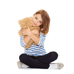 Image showing cute little girl hugging teddy bear