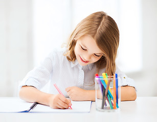 Image showing little student girl drawing at school