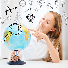 Image showing student girl with globe at school