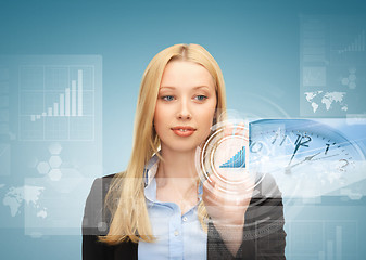 Image showing businesswoman pointing at graph