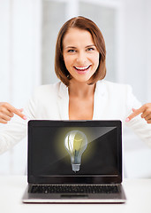 Image showing smiling woman with laptop pc