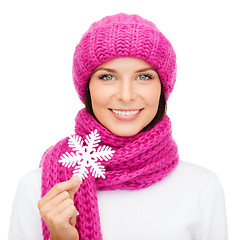 Image showing woman in hat and muffler with big snowflake