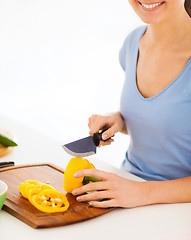 Image showing woman cutting vegetables