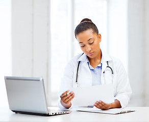 Image showing female doctor with laptop pc