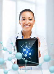 Image showing african female doctor with tablet pc and molecules