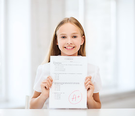 Image showing girl with test and grade at school