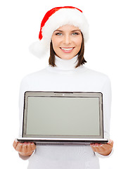 Image showing woman in santa helper hat with laptop computer