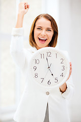 Image showing businesswoman with clock