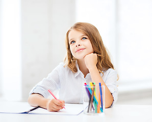 Image showing little student girl drawing at school